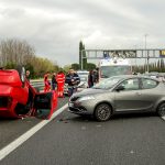 two cars in an accident on a highway