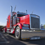 red big rig semi truck with blurred background