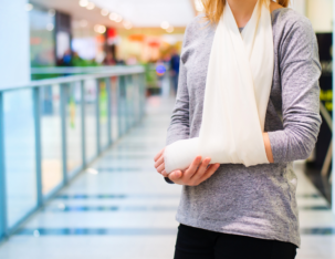 woman hurt and wearing a sling