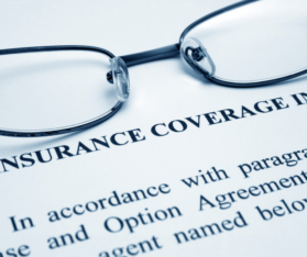 glasses on an insurance coverage form