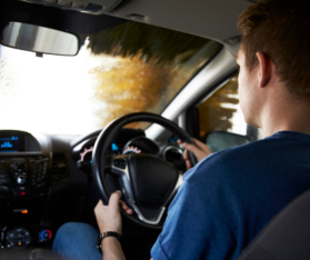 man driving a car during daylight