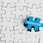 puzzle with blue piece that says mediation