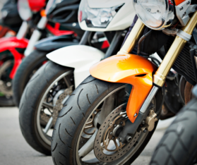 motorcycles standing in a line
