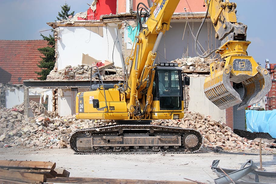 Bulldozer destroying condemned property.