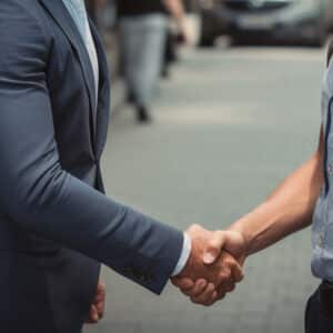 man shaking hands with a lawyer for help after a semi truck accident
