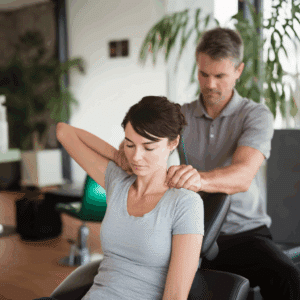 woman with soft tissue injuries getting treated by a chiropractor